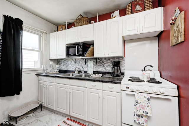 1810 Calhoun St, Indianapolis, IN 46203 - kitchen featuring electric range, black microwave, white cabinetry, dark countertops, and tasteful backsplash