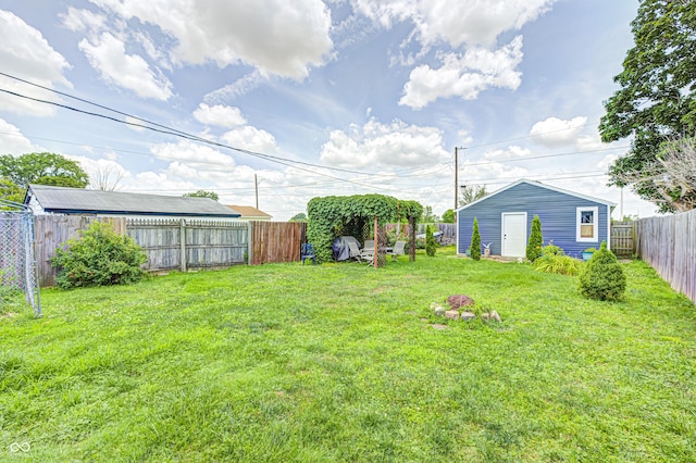 1810 Calhoun St, Indianapolis, IN 46203 - fenced backyard with an outbuilding