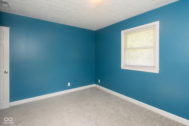 8047 E 48th St, Indianapolis, IN 46226 - empty room featuring a textured ceiling and carpet