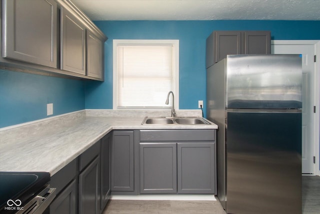 8047 E 48th St, Indianapolis, IN 46226 - kitchen with stainless steel appliances, gray cabinetry, and light countertops