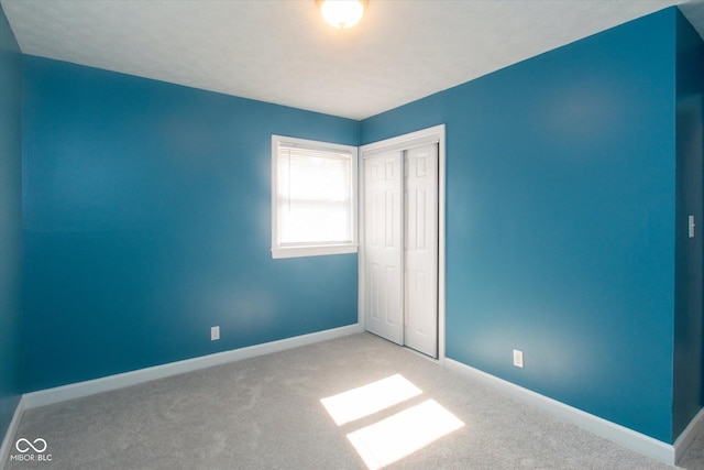 8047 E 48th St, Indianapolis, IN 46226 - unfurnished bedroom featuring a closet and carpet