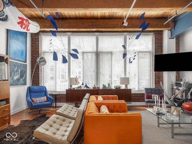 430 N Park Ave Unit 104, Indianapolis, IN 46202 - living room with a wood ceiling with exposed beams, brick wall, and wood finished floors