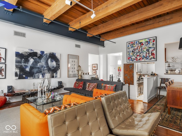 430 N Park Ave Unit 104, Indianapolis, IN 46202 - living room featuring a wooden ceiling with exposed beams, wood finished floors, and track lighting