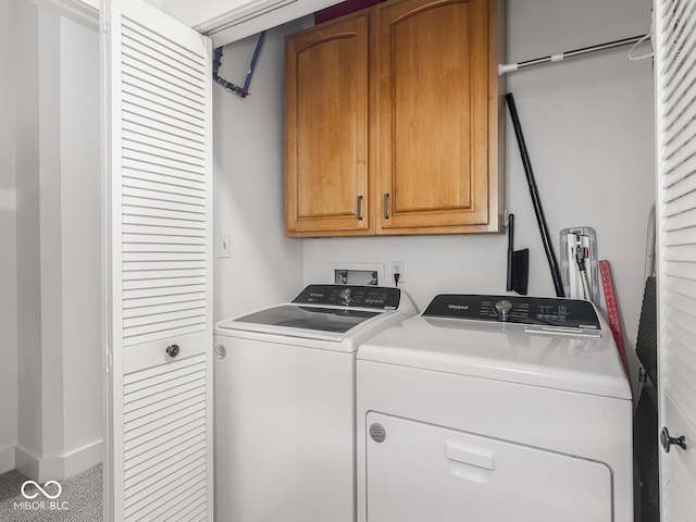 430 N Park Ave Unit 104, Indianapolis, IN 46202 - washroom featuring cabinet space and washing machine and clothes dryer