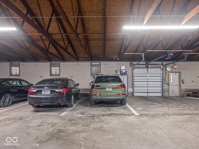 430 N Park Ave Unit 104, Indianapolis, IN 46202 - parking deck featuring a garage door opener