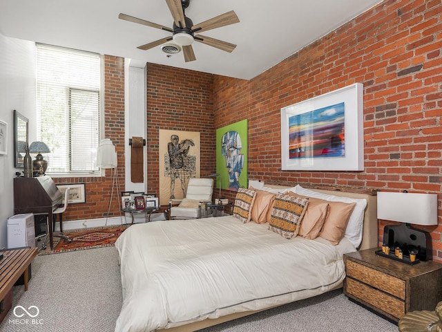 430 N Park Ave Unit 104, Indianapolis, IN 46202 - bedroom featuring brick wall, carpet flooring, and ceiling fan