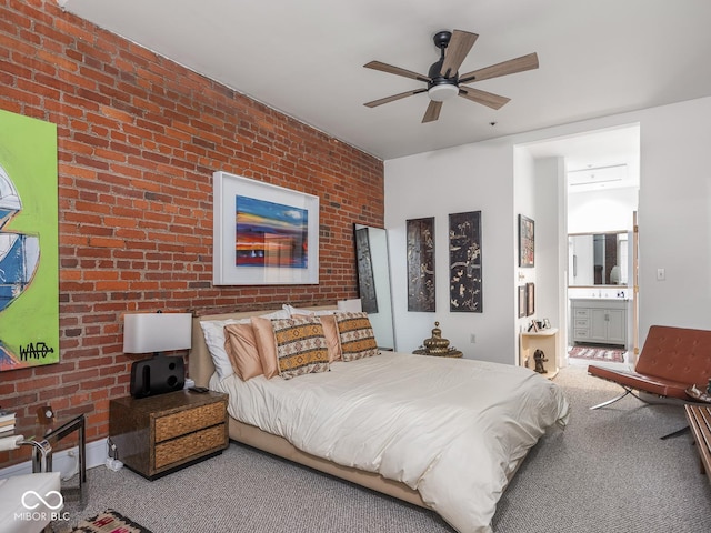 430 N Park Ave Unit 104, Indianapolis, IN 46202 - carpeted bedroom with brick wall, connected bathroom, and a ceiling fan