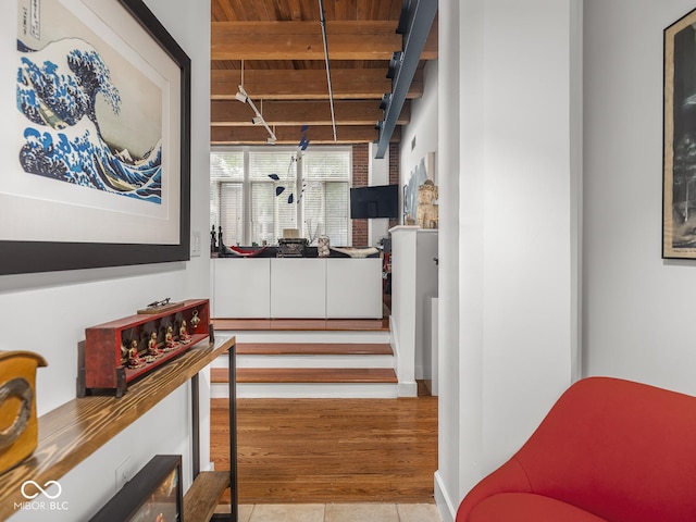 430 N Park Ave Unit 104, Indianapolis, IN 46202 - stairs featuring a wooden ceiling with exposed beams and tile patterned flooring