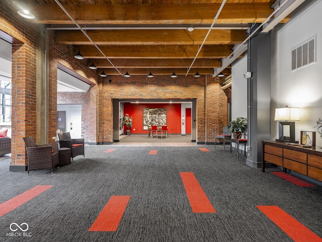 430 N Park Ave Unit 104, Indianapolis, IN 46202 - lobby featuring brick wall and a high ceiling