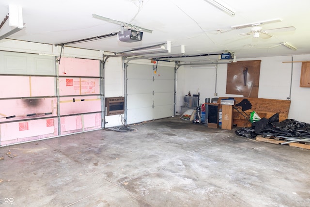 602 Valley Dr, Crawfordsville, IN 47933 - garage with a garage door opener and heating unit