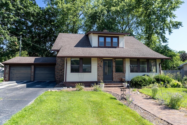 602 Valley Dr, Crawfordsville, IN 47933 - view of front of home featuring brick siding, a front lawn, a shingled roof, and a garage