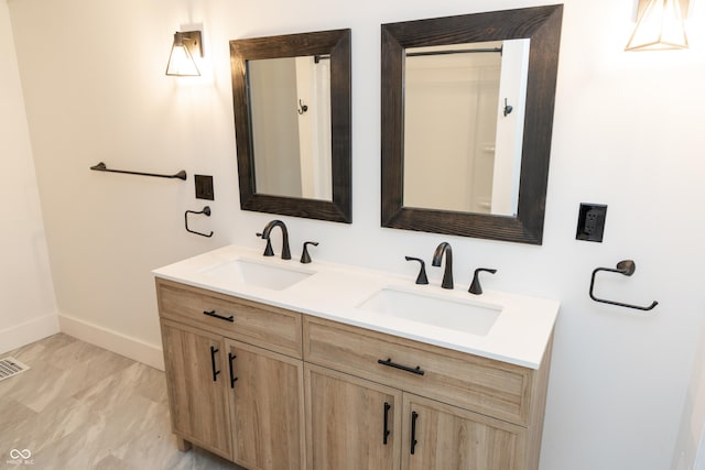 602 Valley Dr, Crawfordsville, IN 47933 - bathroom with double vanity and baseboards