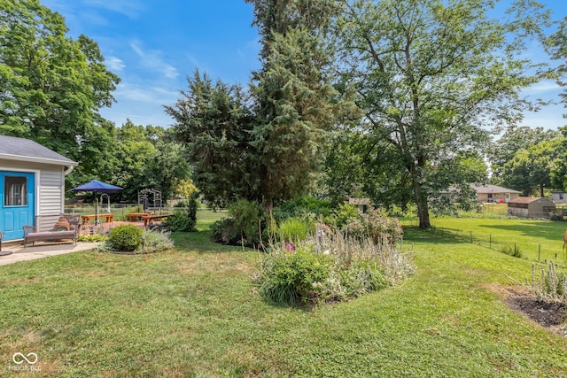 921 Morgan Dr, Indianapolis, IN 46227 - view of yard featuring a patio area and view of wooded area
