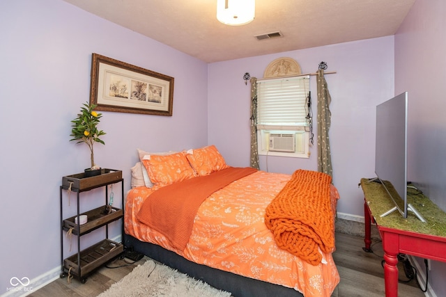 921 Morgan Dr, Indianapolis, IN 46227 - bedroom featuring wood finished floors and cooling unit
