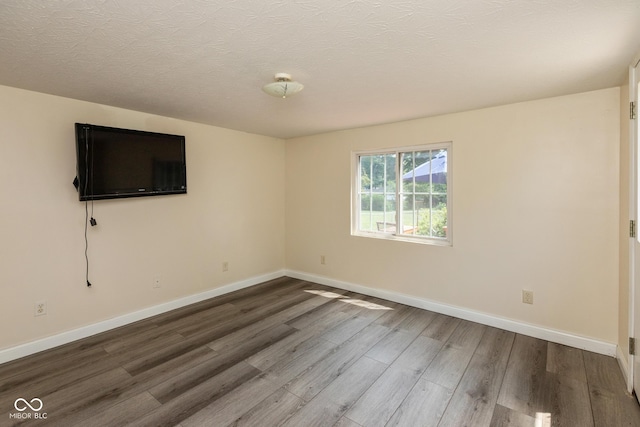 921 Morgan Dr, Indianapolis, IN 46227 - unfurnished room featuring dark wood finished floors and a textured ceiling