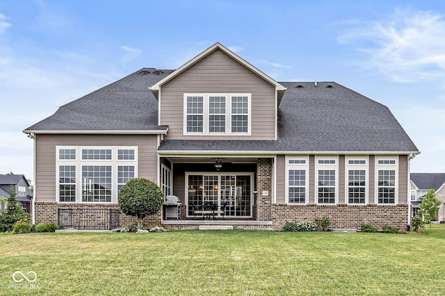 14293 Dufton Ct, Carmel, IN 46074 - rear view of house featuring brick siding, a lawn, and a shingled roof