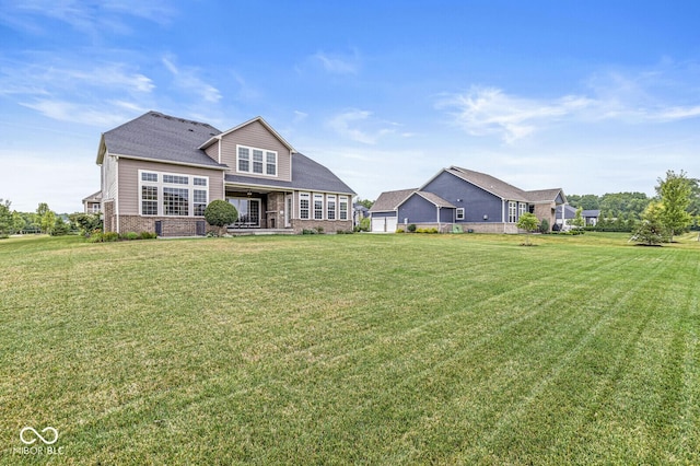 14293 Dufton Ct, Carmel, IN 46074 - rear view of property with a lawn and brick siding