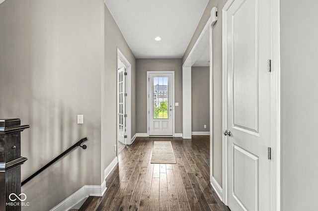 14293 Dufton Ct, Carmel, IN 46074 - doorway to outside featuring dark wood finished floors and baseboards