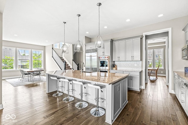 14293 Dufton Ct, Carmel, IN 46074 - kitchen with stainless steel appliances, dark wood-style floors, healthy amount of natural light, and recessed lighting