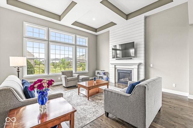 14293 Dufton Ct, Carmel, IN 46074 - living area with coffered ceiling, a fireplace, dark wood-type flooring, beam ceiling, and recessed lighting