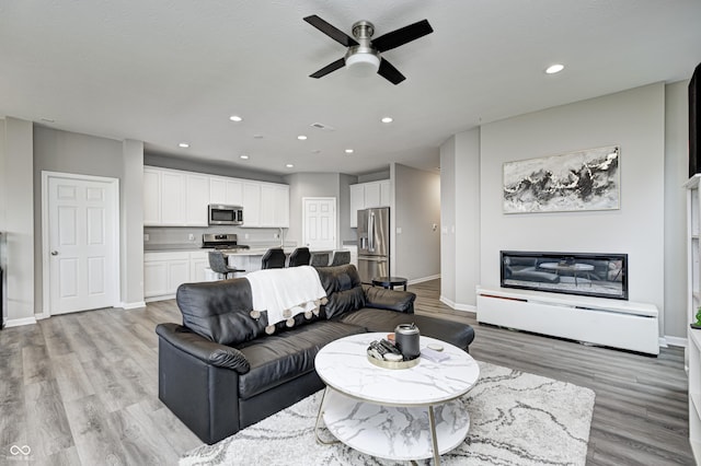 8108 Nik St, Brownsburg, IN 46112 - living room featuring recessed lighting, ceiling fan, and light wood-type flooring