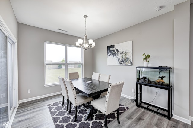 8108 Nik St, Brownsburg, IN 46112 - dining area featuring a chandelier and wood finished floors