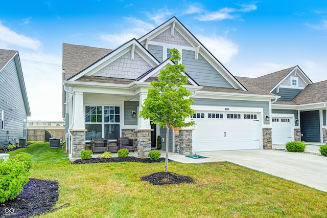 8108 Nik St, Brownsburg, IN 46112 - craftsman inspired home with a porch, stone siding, a garage, driveway, and a shingled roof