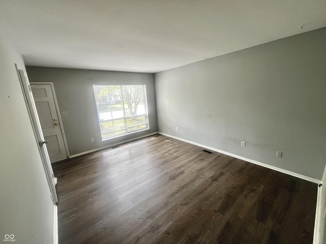 3525 Luewan Ct, Indianapolis, IN 46235 - unfurnished room with dark wood-style flooring and baseboards