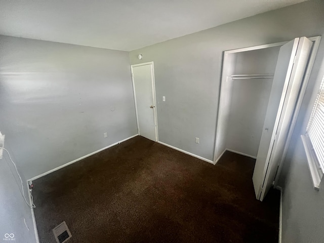3525 Luewan Ct, Indianapolis, IN 46235 - unfurnished bedroom featuring a closet and dark colored carpet