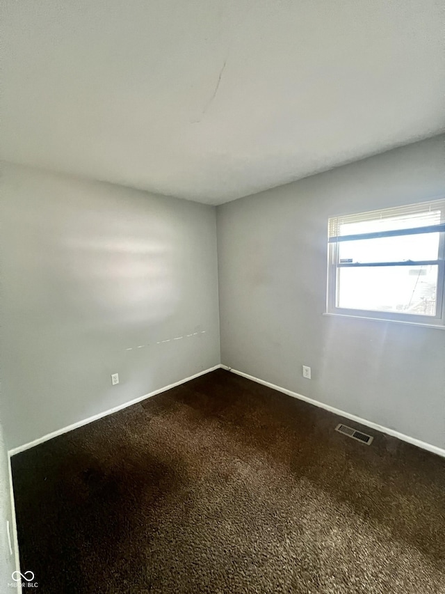 3525 Luewan Ct, Indianapolis, IN 46235 - empty room featuring dark carpet and baseboards