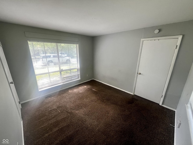 3525 Luewan Ct, Indianapolis, IN 46235 - empty room with dark carpet and baseboards