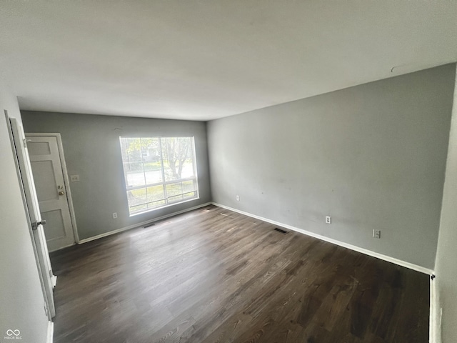 3525 Luewan Ct, Indianapolis, IN 46235 - spare room featuring dark wood finished floors and baseboards