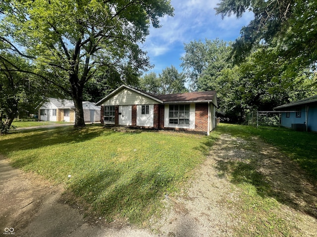 3525 Luewan Ct, Indianapolis, IN 46235 - ranch-style home with a front yard, driveway, and brick siding