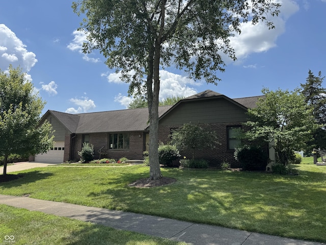1220 Countryside Ln, Columbus, IN 47201 - ranch-style house with brick siding, a front yard, a garage, and concrete driveway