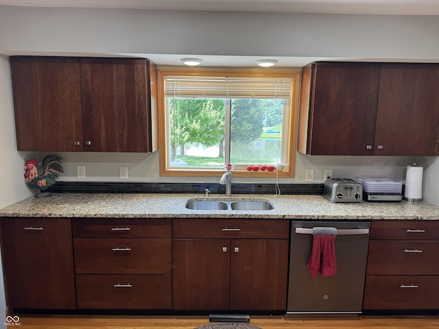 1220 Countryside Ln, Columbus, IN 47201 - kitchen featuring dishwasher, light stone countertops, and dark brown cabinetry