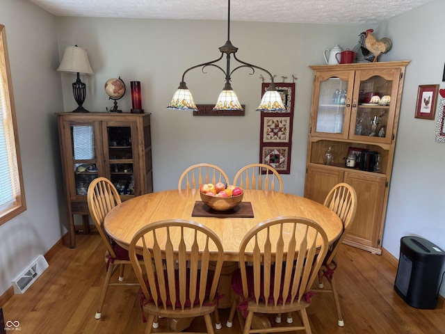 1220 Countryside Ln, Columbus, IN 47201 - dining room featuring wood finished floors and a textured ceiling