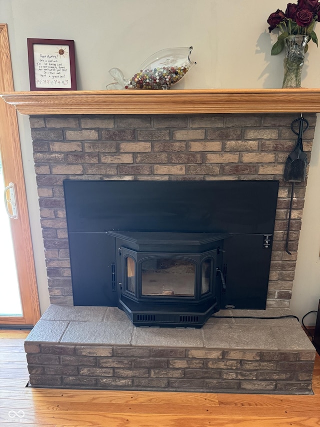 1220 Countryside Ln, Columbus, IN 47201 - detailed view of a wood stove and wood finished floors
