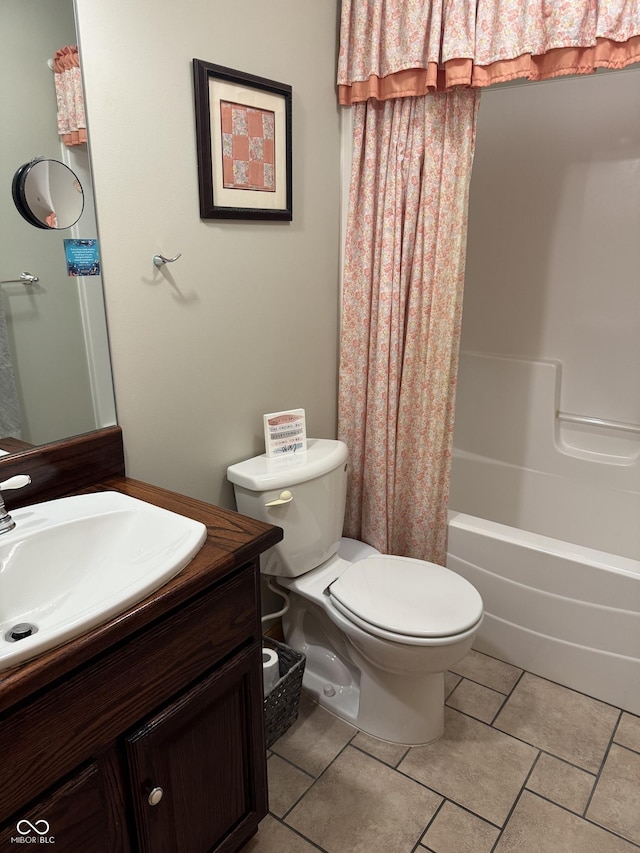 1220 Countryside Ln, Columbus, IN 47201 - full bathroom featuring vanity, shower / bath combo with shower curtain, and tile patterned floors