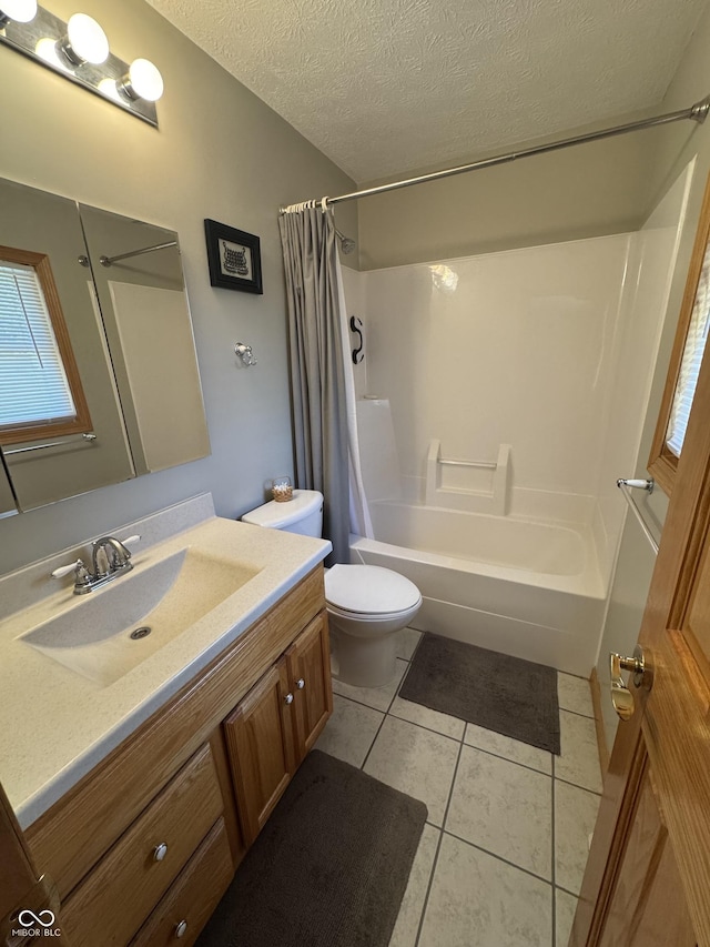 1220 Countryside Ln, Columbus, IN 47201 - bathroom with vanity, shower / bath combo, tile patterned flooring, and a textured ceiling