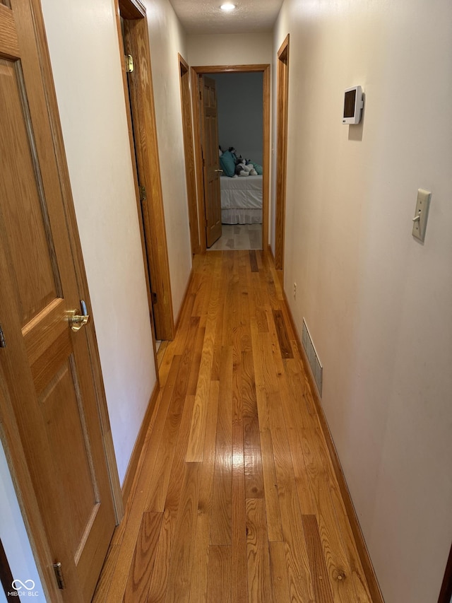 1220 Countryside Ln, Columbus, IN 47201 - hall with light wood-style flooring and baseboards