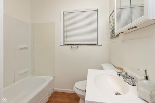 5702 E 17th St, Indianapolis, IN 46218 - full bath featuring wood finished floors, vanity, and tub / shower combination