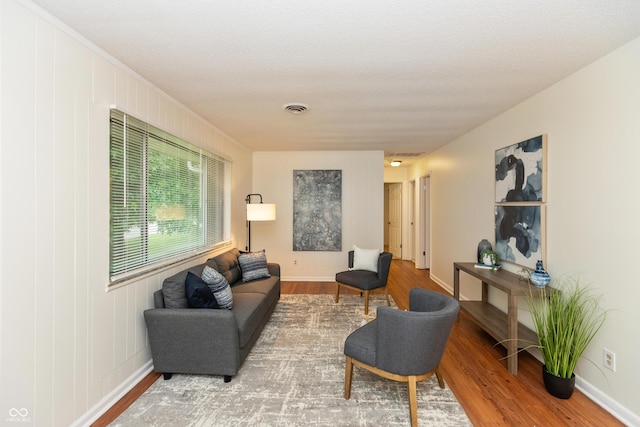 5702 E 17th St, Indianapolis, IN 46218 - living area with wood finished floors and baseboards