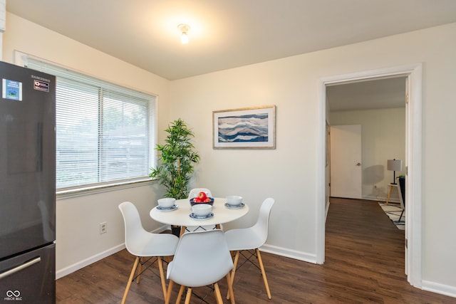 5702 E 17th St, Indianapolis, IN 46218 - dining area featuring dark wood-style flooring and baseboards