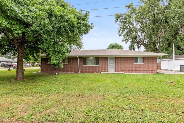 5702 E 17th St, Indianapolis, IN 46218 - ranch-style house featuring a front lawn and brick siding