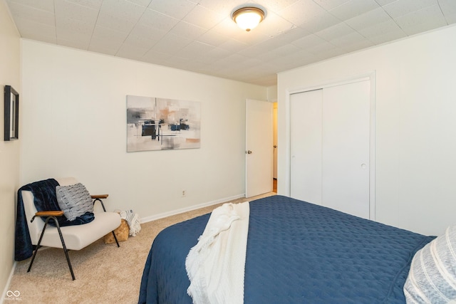 5702 E 17th St, Indianapolis, IN 46218 - carpeted bedroom featuring a closet and baseboards