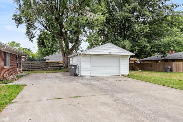 5702 E 17th St, Indianapolis, IN 46218 - detached garage featuring driveway