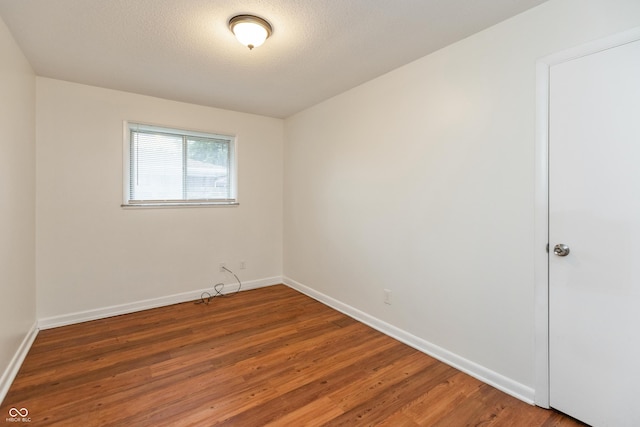 5702 E 17th St, Indianapolis, IN 46218 - empty room with wood finished floors