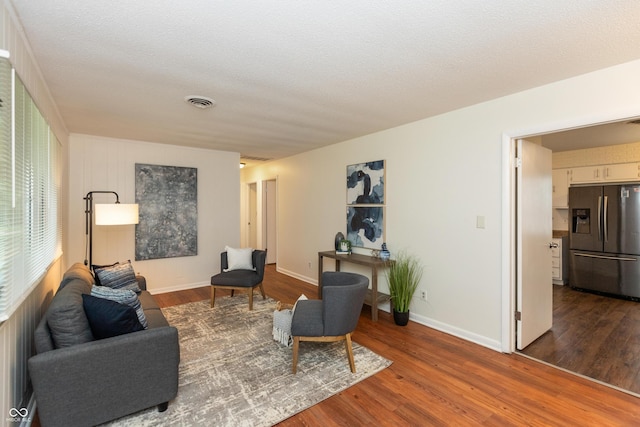 5702 E 17th St, Indianapolis, IN 46218 - living room with wood finished floors and baseboards