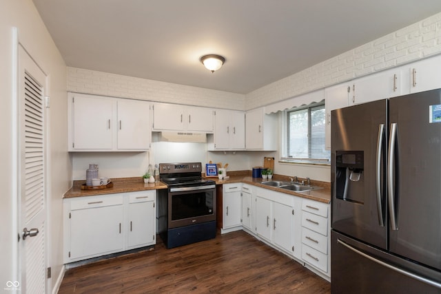 5702 E 17th St, Indianapolis, IN 46218 - kitchen featuring appliances with stainless steel finishes, under cabinet range hood, white cabinetry, and dark wood-style floors