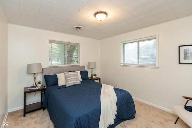 5702 E 17th St, Indianapolis, IN 46218 - bedroom with light colored carpet